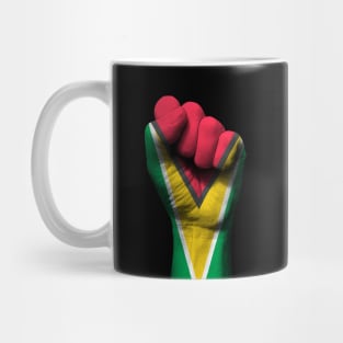 Flag of Guyana on a Raised Clenched Fist Mug